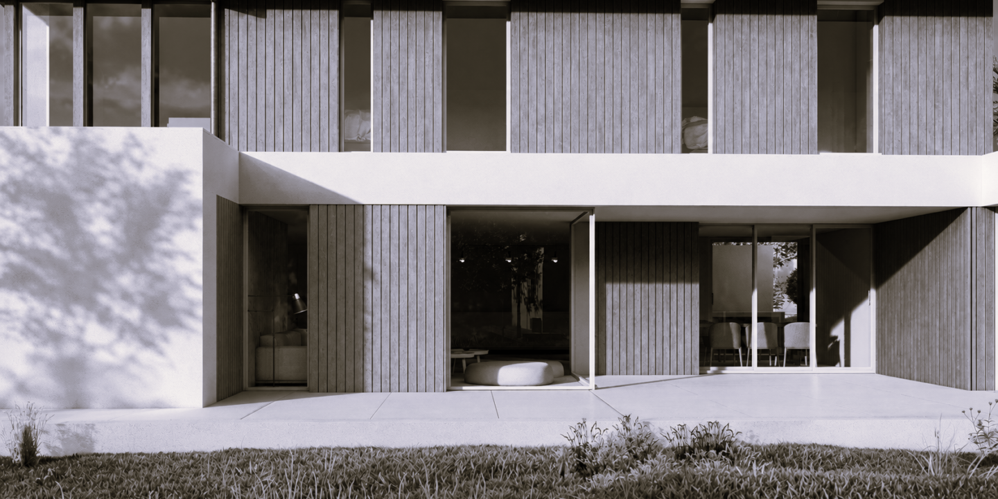 façade jardin d'une maison contemporaine à Biarritz, bardage bois vertical, terrasse en béton et patio ombragé.